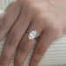 3 carat oval cut diamond hidden halo solitaire engagement ring on model hand