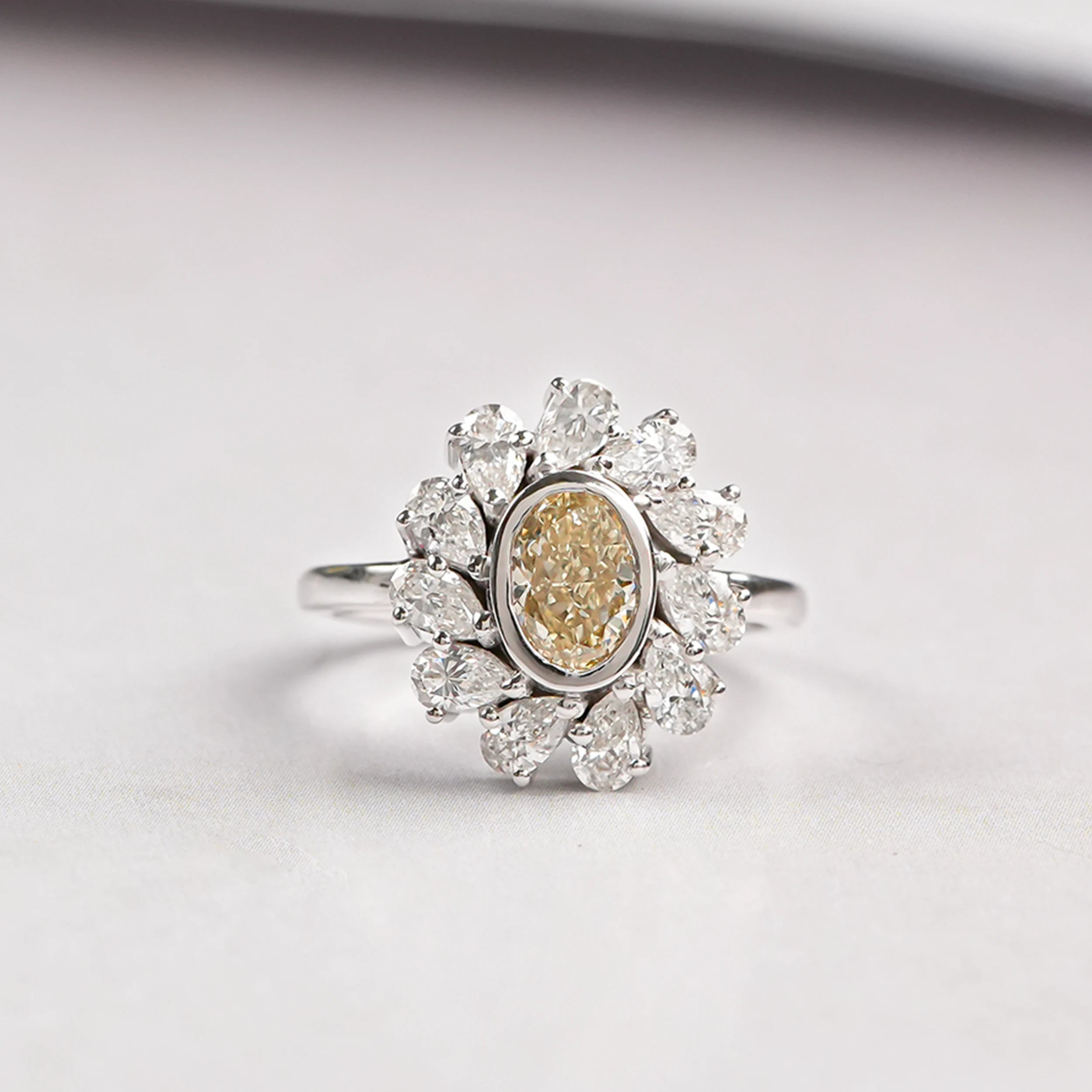 yellow oval diamond halo ring