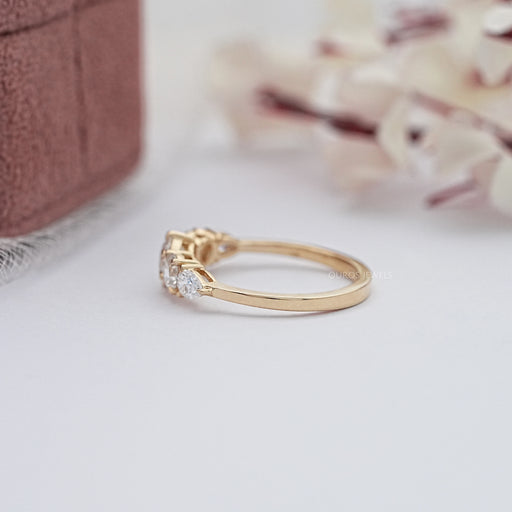 side view of round and pear cut lab diamond five stone engagement ring