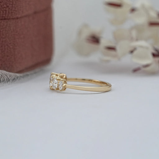 side view of round and marquise cut lab diamond five stone engagement ring