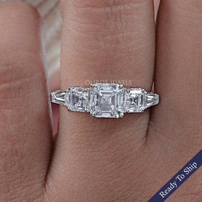front view of asscher cut diamond five stone engagement ring with white gold band