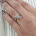 old mine cushion cut diamond hidden halo engagement ring in finger