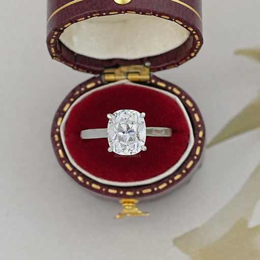 old mine cushion cut lab diamond engagement ring in red jewelry box