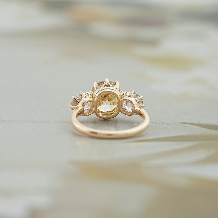 back view of fancy yellow old mine cushion diamond three stone wedding ring