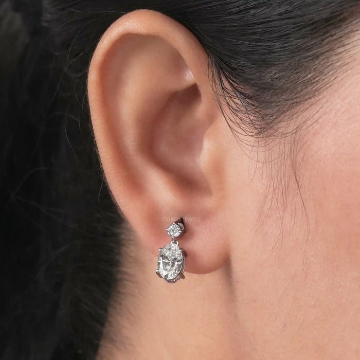 round and oval lab created diamond prong setting drop dangle earrings on ear