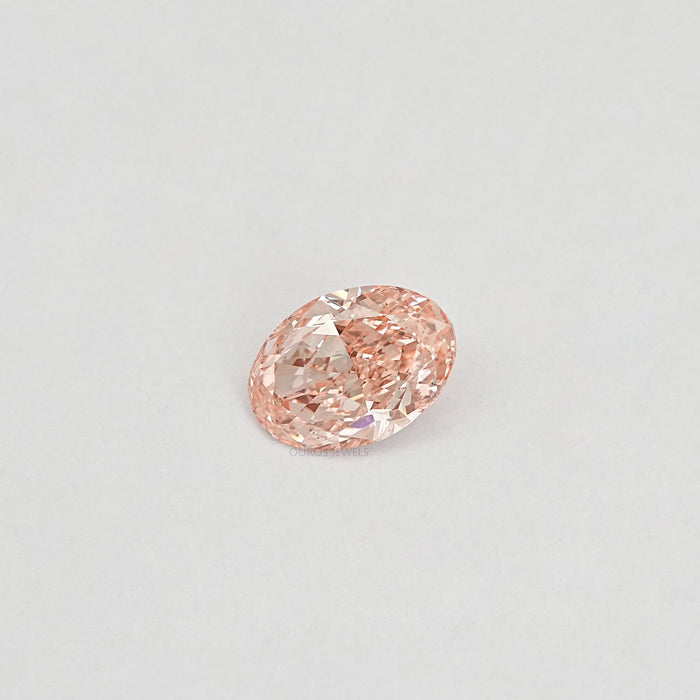 oval shape lab created diamond on white surface