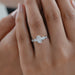 oval and pear cut lab diamond five stone engagement ring on model's finger