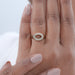 east west oval shape double halo semi mount wedding ring on model's finger