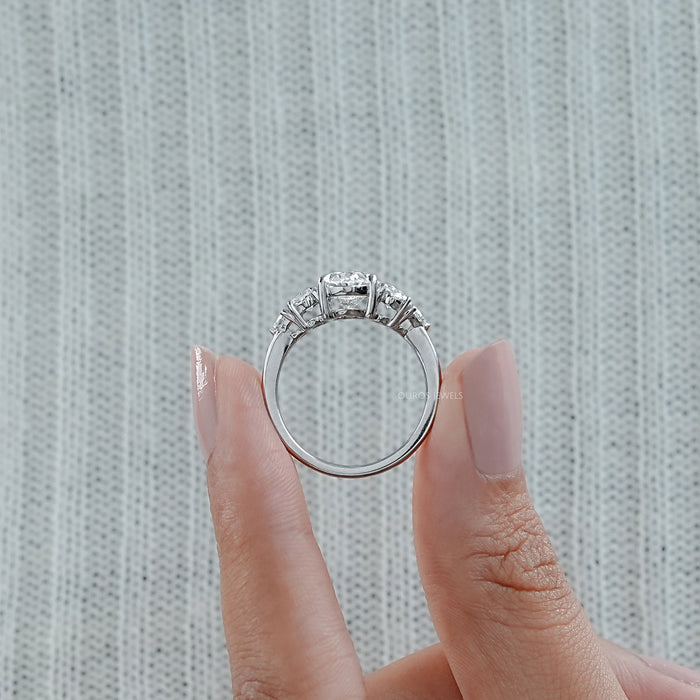 close view of oval and trillion cut lab diamond five stone engagement ring