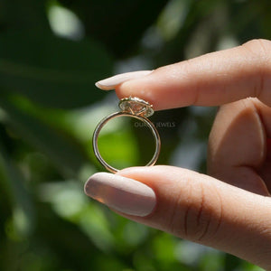 [ a women holding Oval Diamond Ring]-[Ouros Jewels]