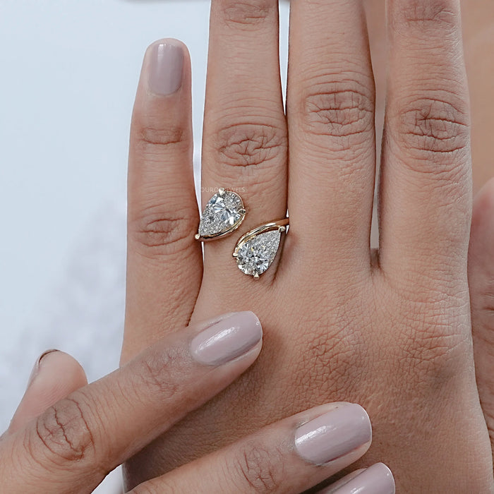 pear-cut lab-grown diamond toi et moi engagement ring on model's finger
