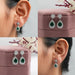 pear cut emerald halo drop earrings