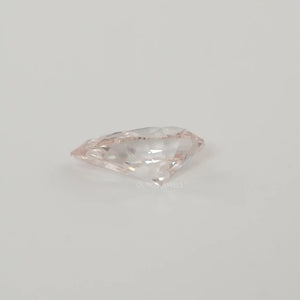 Side View of Pink Pear Lab Created Diamond on White Background.