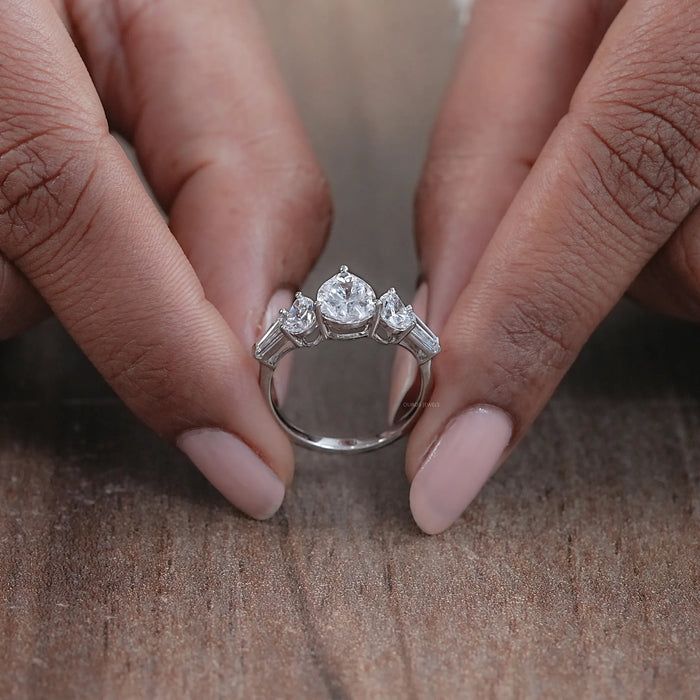 close view of pear cut lab diamond five stone engagement ring in white gold band