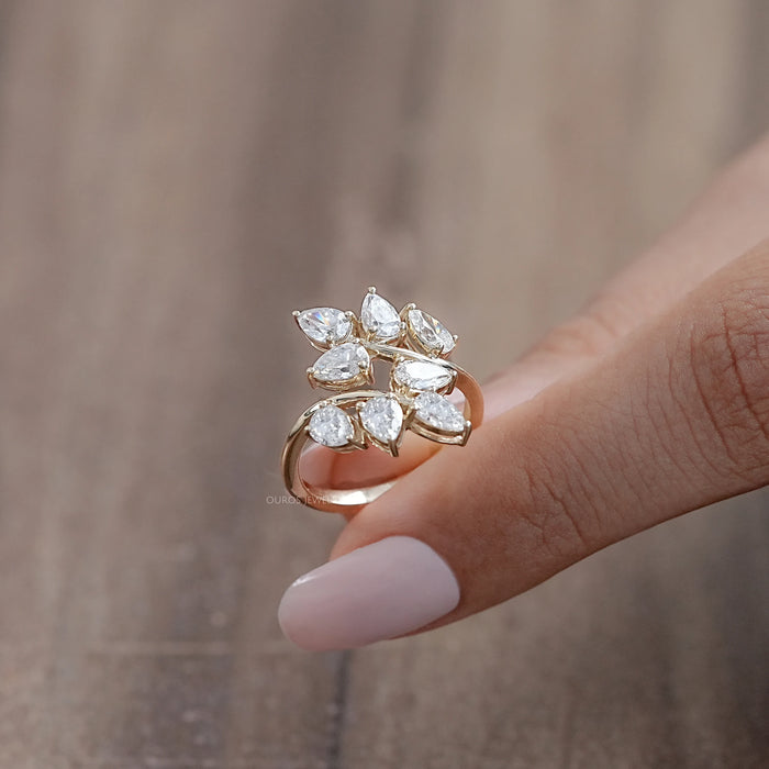 side view of pear-cut lab diamond leaf design cluster engagement ring