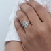 pear cut lab diamond solitaire engagement ring in finger of model's