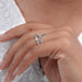 baguette and pear cut diamond spiral colored engagement ring on model's finger