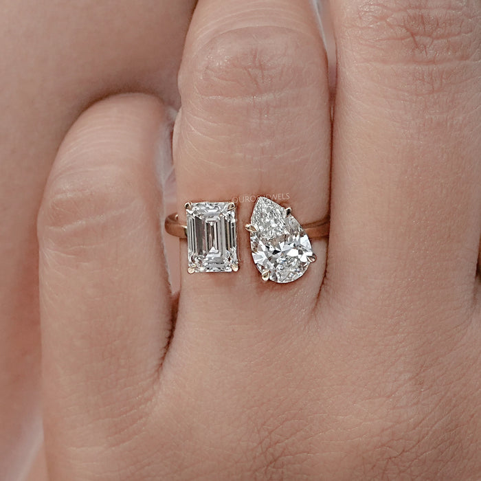 front view of emerald-cut and pear lab diamond toi et moi engagement ring