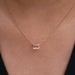 pink emerald cut bezel set diamond pendant