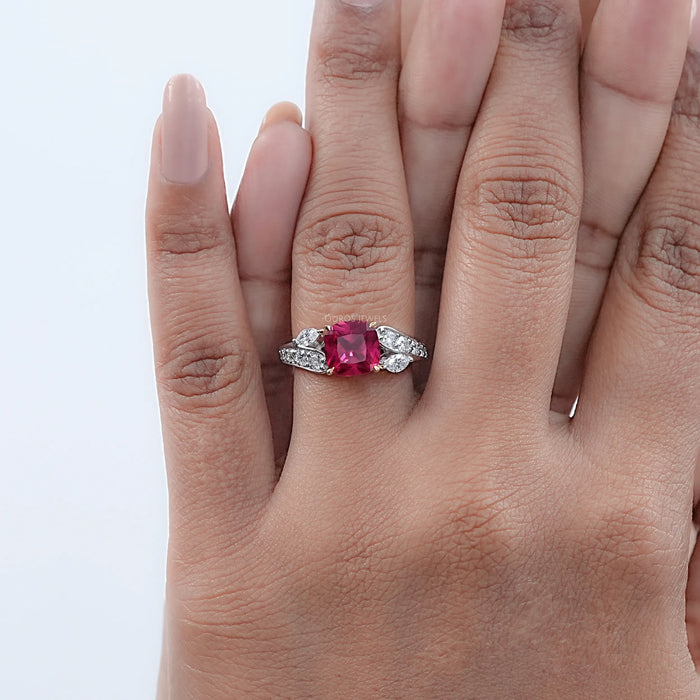 pink ruby cushion cut gemstone solitaire split-shank wedding ring in finger