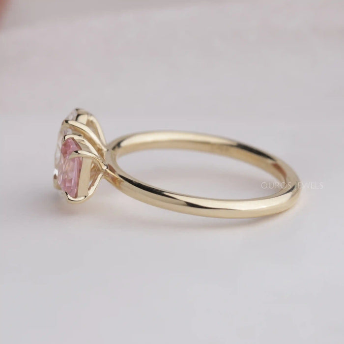 pink diamond toi moi ring on the plain white surface
