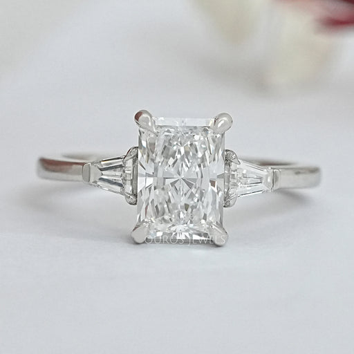 brilliant radiant cut and tapered baguette three stone wedding ring's front view