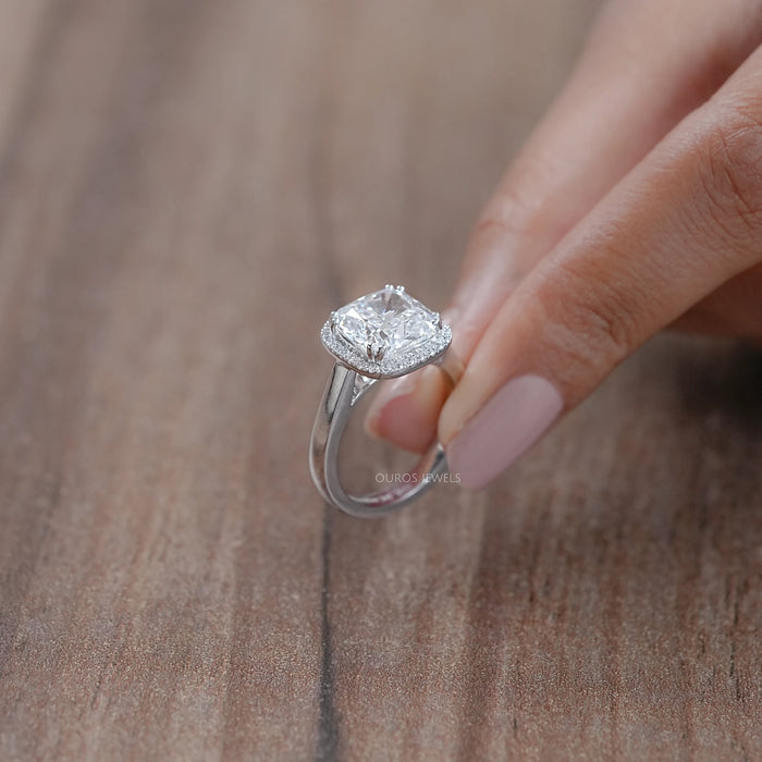 side close view of cushion cut lab diamond halo engagement ring