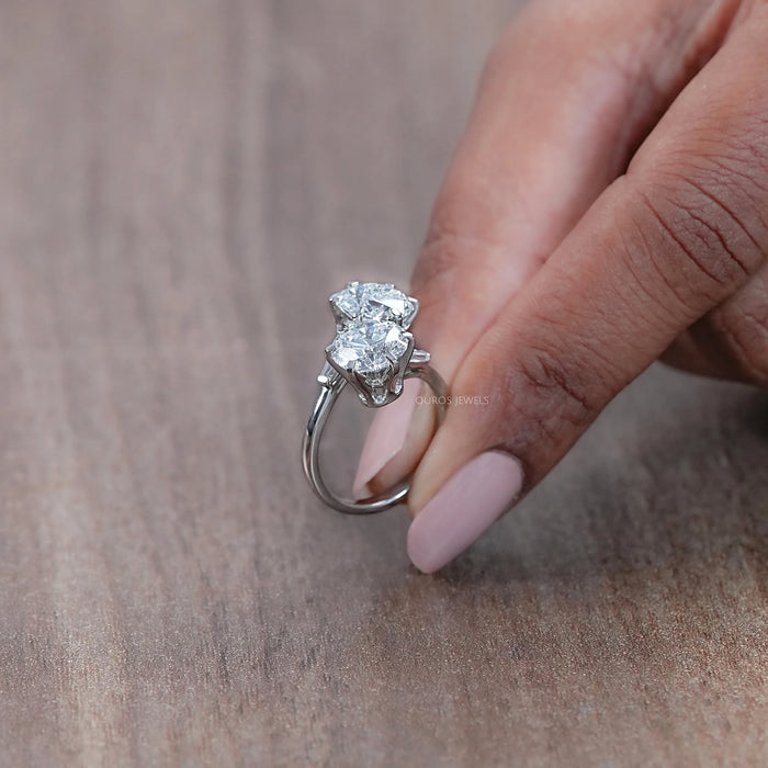 side view of round cut lab diamond toi et moi anniversary ring in finger