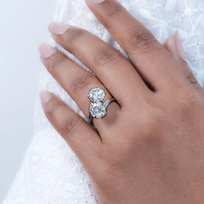 round-cut lab-grown diamond toi et moi anniversary ring on model's finger