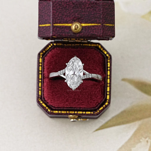 front view of old mine moval cut diamond split shank wedding ring in jewelry box