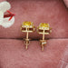 yellow cushion cut diamond halo stud earrings in gold shown in jewelry box