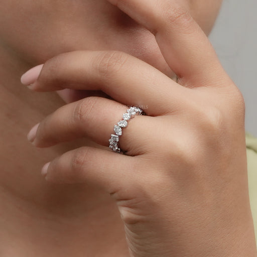 multi shape lab created diamond white gold eternity band on finger