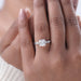 square old mine cushion cut diamond 3 stone engagement ring in model's finger