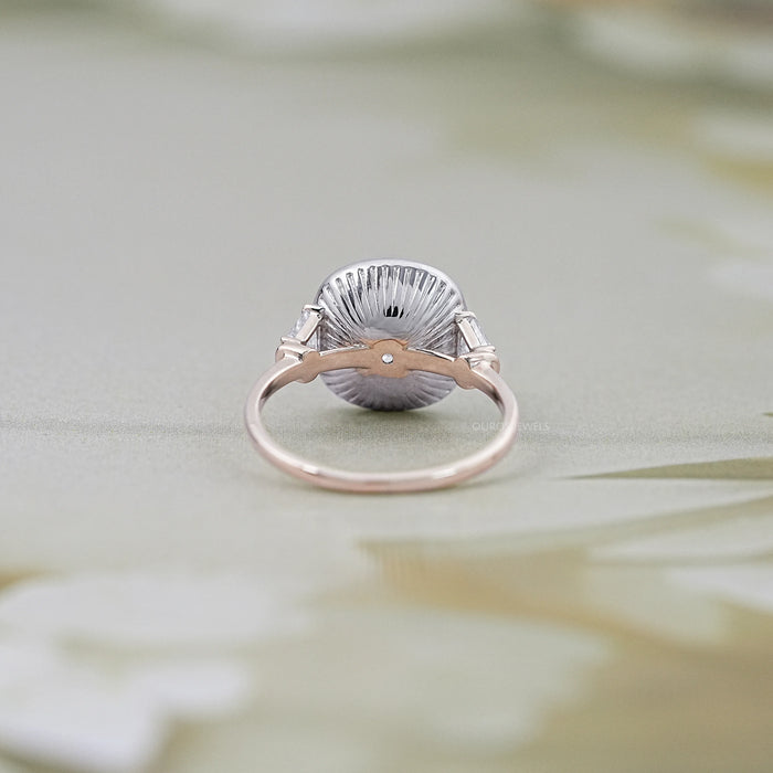 square old mine cushion diamond halo engagement ring's back view on grey fabric