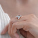 square old mine cushion lab diamond halo engagement ring on model's finger