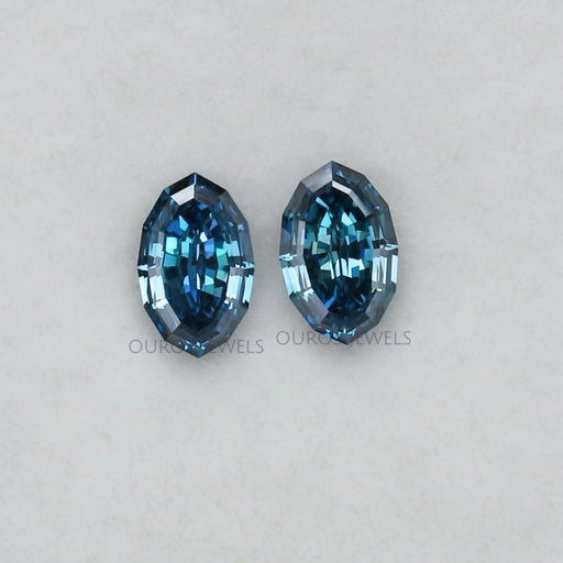 front view of step cut blue oval lab grown diamonds pair