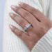 square cushion cut lab diamond five stone engagement ring on model's  finger