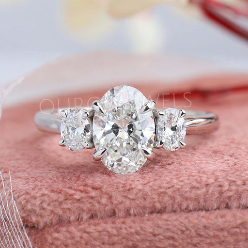 front view of oval cut lab grown diamond three stone engagement ring