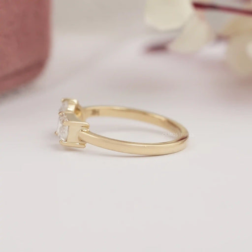 side view of oval and emerald-cut lab diamond toi et moi engagement ring