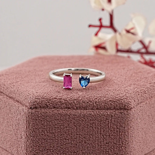 pink emerald and blue heart cut gemstone open cuff ring on jewelry box