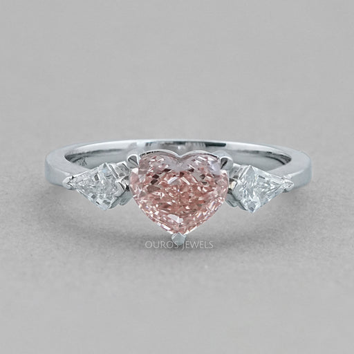 front view of fancy pink heart cut lab diamond 3 stone engagement ring