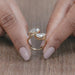 close view of pear-cut lab-grown diamond toi et moi engagement ring