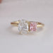 Wide oval engagement ring with pink radiant diamond 
