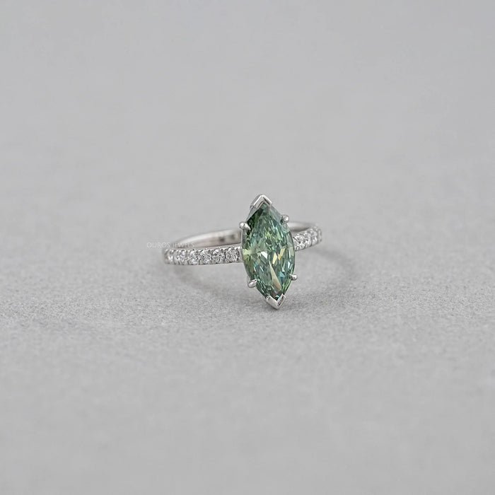 side view of green marquise-cut lab diamond solitaire accent wedding ring