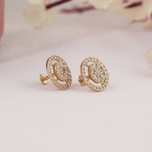 A Side View of Round Brilliant Cut Diamond Halo Stud Earrings on soft white surface.