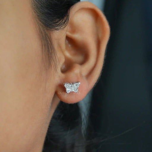 A women wearing Butterfly Cut Diamond Stud Earrings.