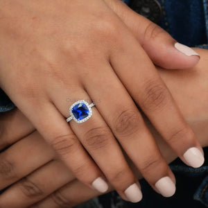 A Women wearing Cushion Cut Blue sapphire gemstone Diamond Ring