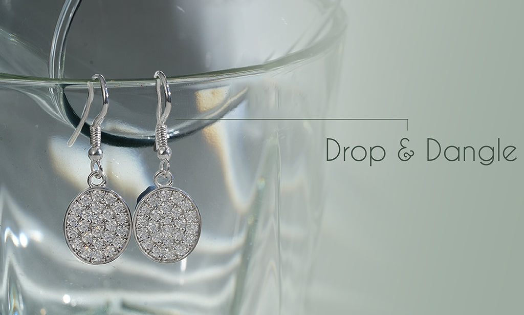 A high-quality image of a pair of cluster Dangal drop earrings featuring multi-cut lab-grown diamonds
