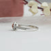 Side View of Round Cut Engagement Ring on White Background