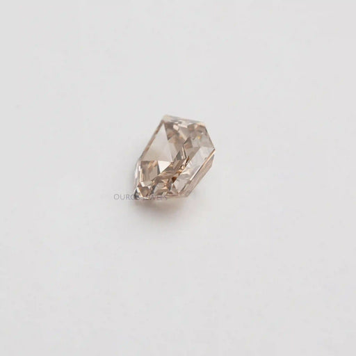 side view of step cut pear shaped lab created diamond loose
